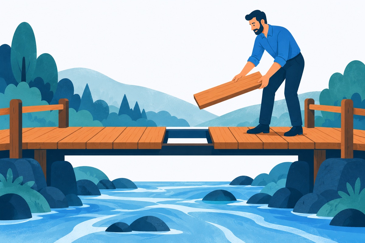 A wooden footbridge over a river with one plank missing in the middle, and a hand holding a single plank that fits the hole exactly.
