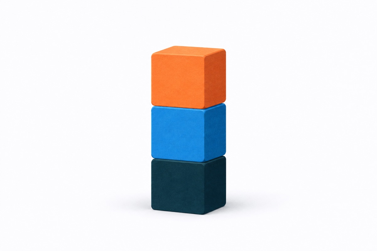 Three blocks of identical size and different colors stacked into a single tower.